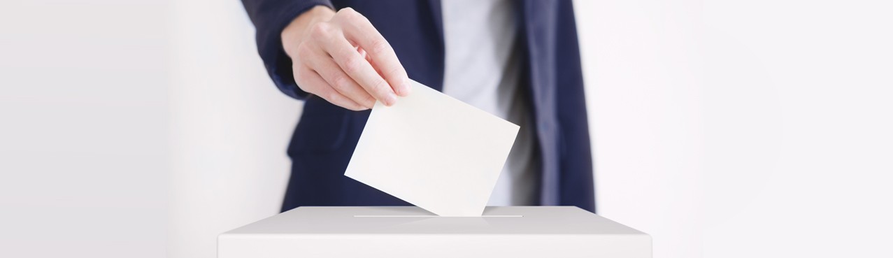 Image of ballot box and hand