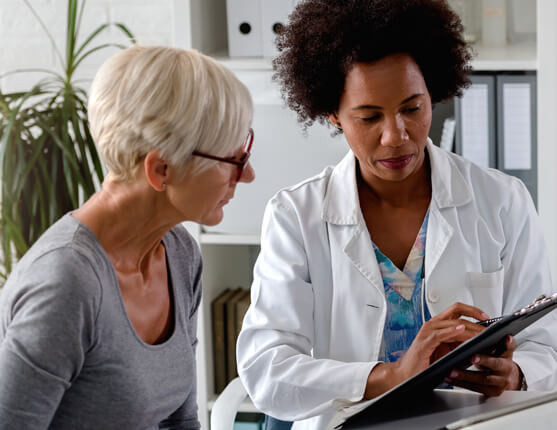 Image: Female doctor speaking with female patient