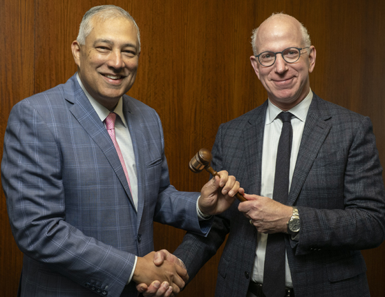 Image: Gavel pass between ASTRO Chair and President