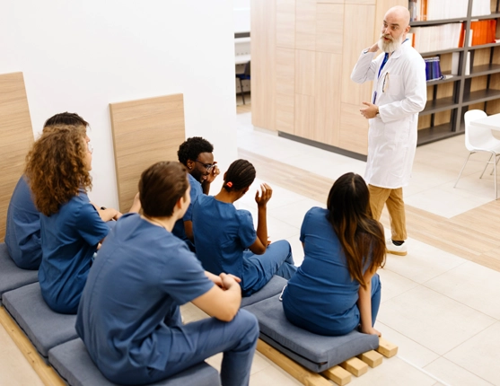 Image: Med students with dr presenting