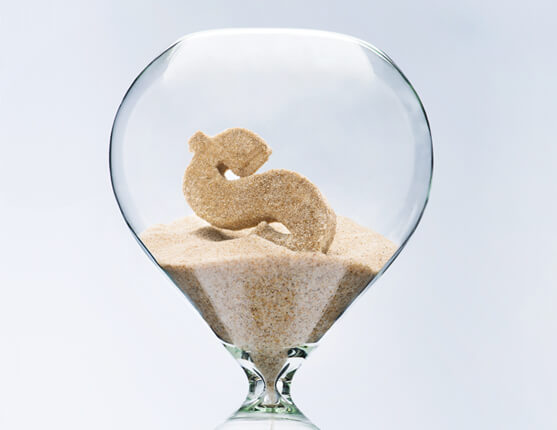 Image: Hour glass with sand; sand forms share of dollar sign