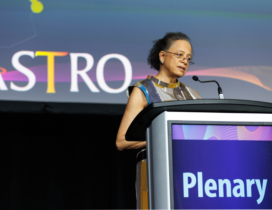 Image: Woman speaking at ASTRO 2022 Plenary Session