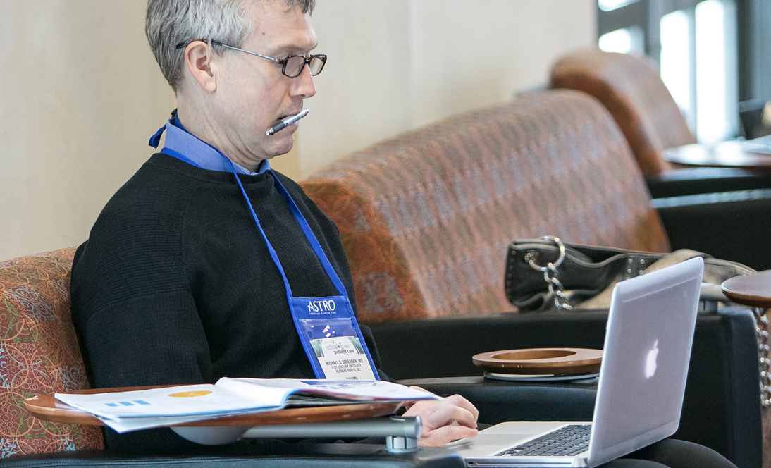 Image: Man looking at computer