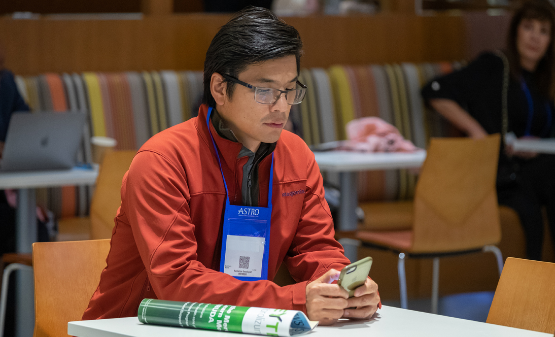Image: Man looking at phone