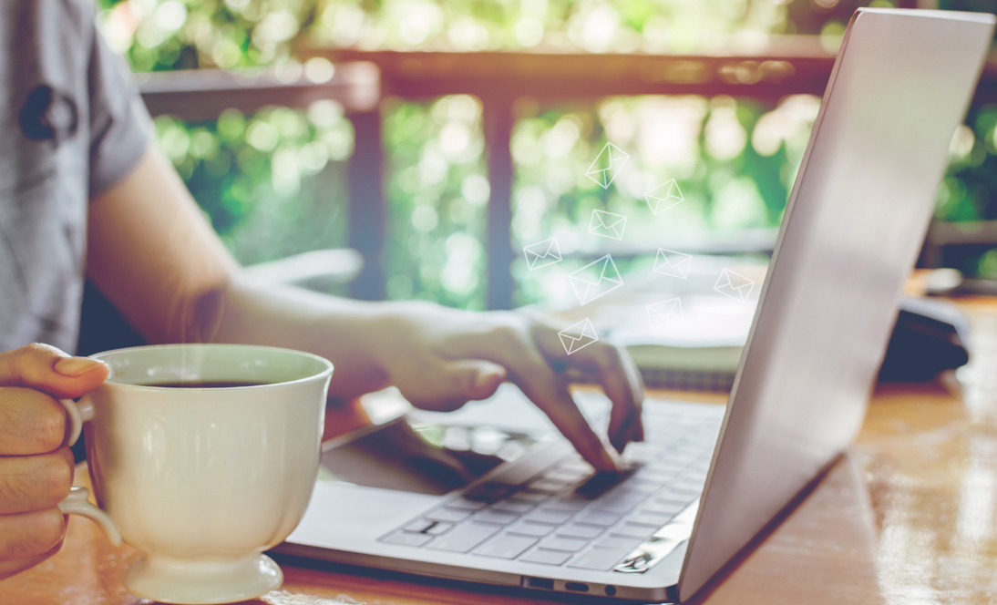 Image: Man with coffee at computer