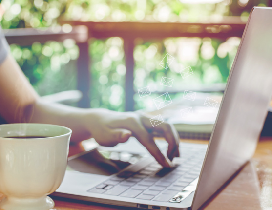 Image: person at laptop with coffee