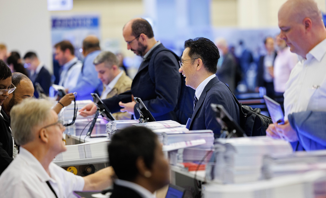 Image: person at registration at meeting