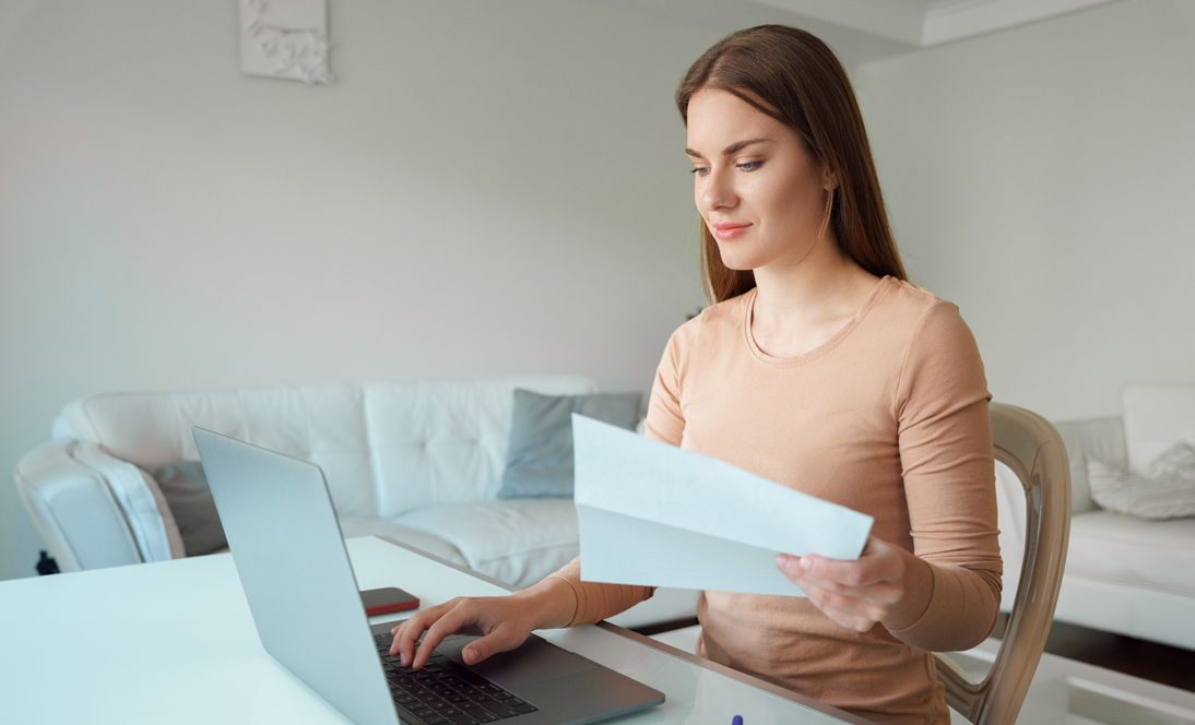 Image: Woman typing on computer