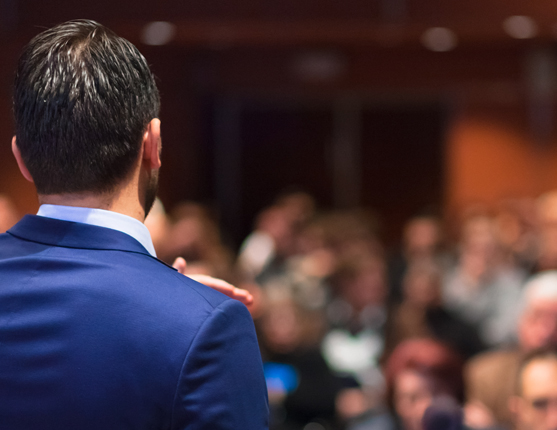 Image: Speaker in front of audience