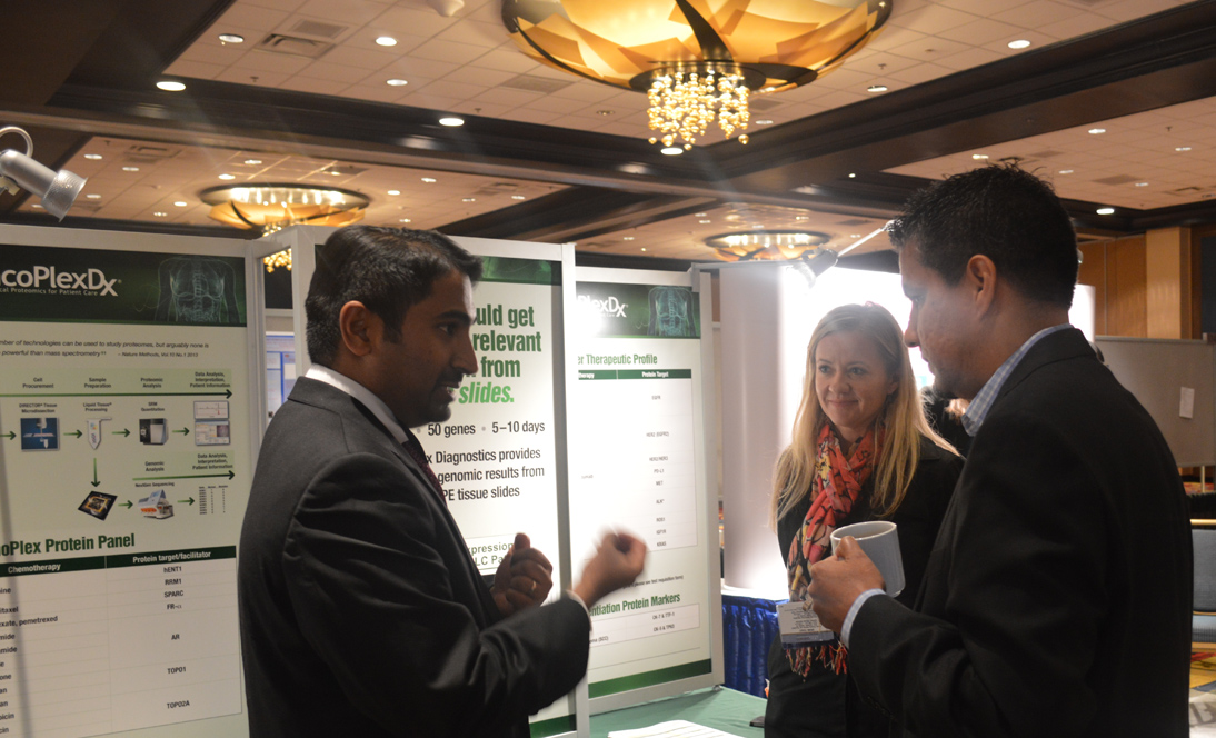 Image: Exhibitor and Attendees at booth