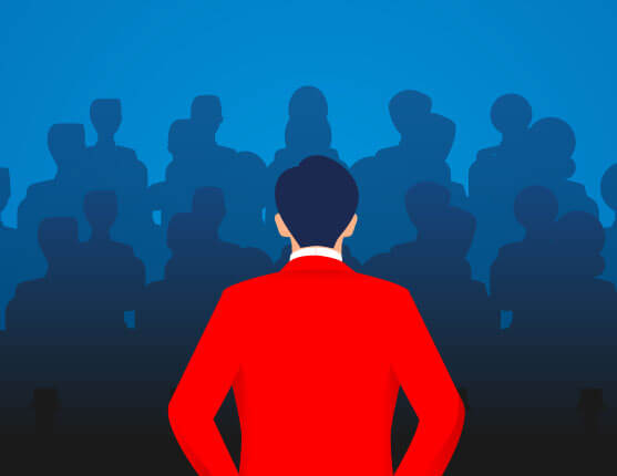 Image: Man speaking in front of people